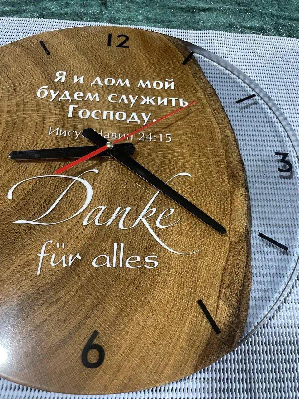 Handmade rustic wooden wall clock with bold black numbers and hands, showing 12:05. Unique engraved gratitude message in Russian and German. Vintage-style oak clock perfect for cozy, modern, or farmhouse interior decor.